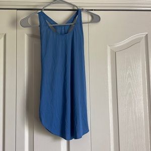 This is a pretty blue running/working out tank top. It is the brand Nike. Size S